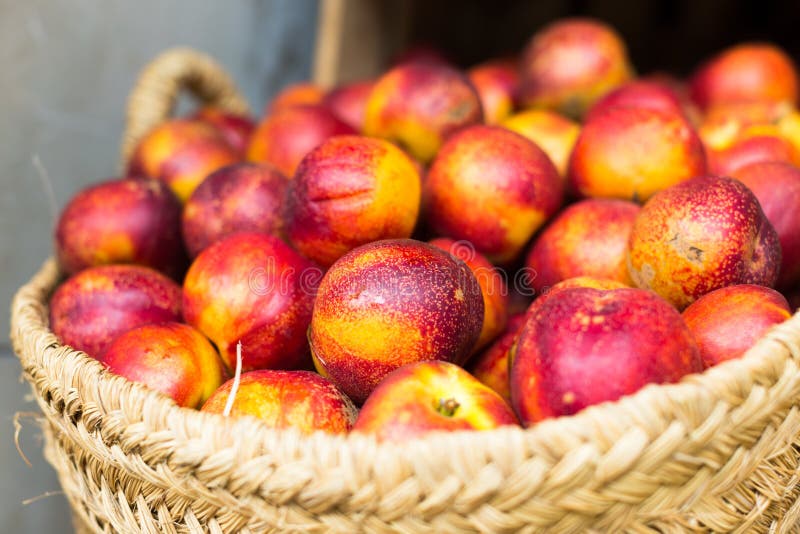Ripe Nectarines in Wicker Baskets on Counter Stock Image Image of