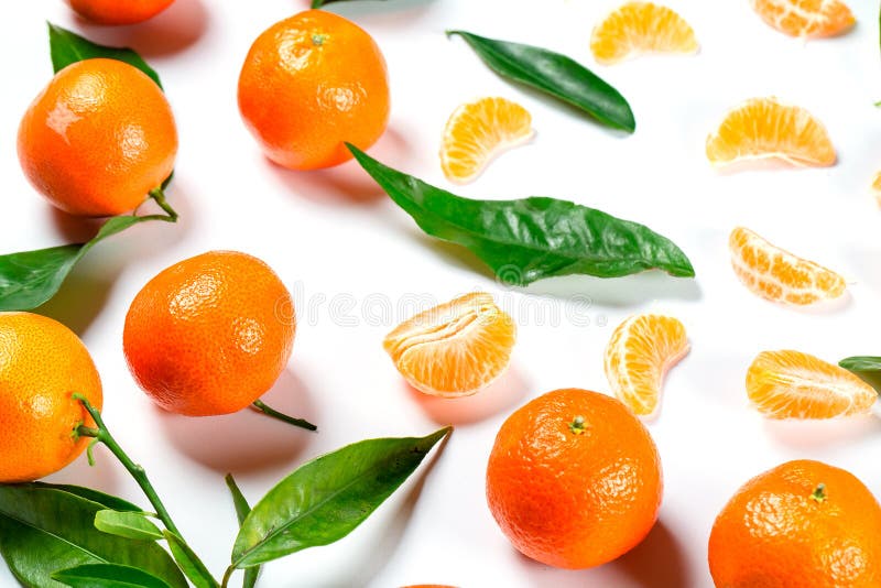 Ripe Orange Tangerine Mandarin With Leaves Close Up On The White