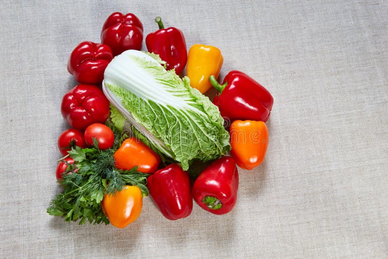 Ripe paprika, cabbage, tomato are filled on a canvas stock photos