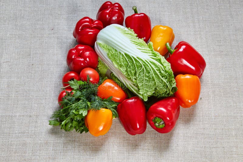 Ripe paprika, tomato, cabbage are filled on a canvas stock photography