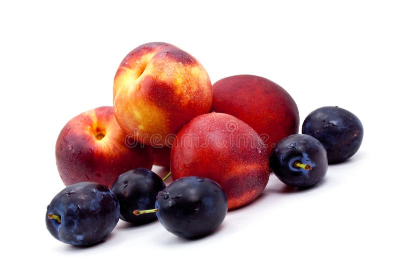 Ripe peach and Plums on a white Plate