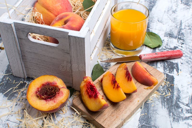 Ripe Peach Slices, a Box of Peaches and Peach Juice Stock Image Image