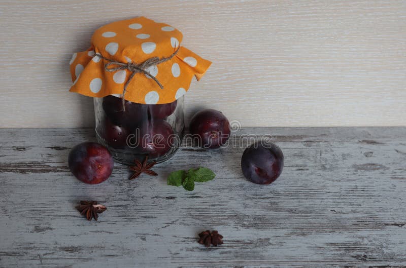 A Ripe Plum in a Jar on the Table. Stock Image Image of fruit, table