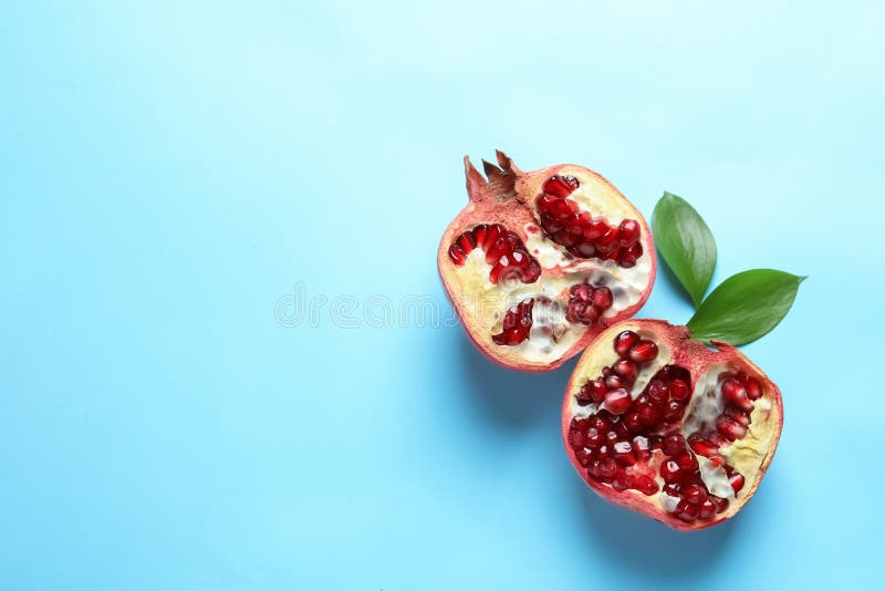 Ripe pomegranate halves on color background stock photography Ripe pomegranate halves on color background stock photography