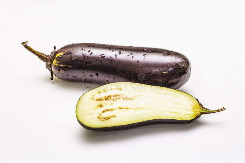 Ripe Single Eggplant. Fresh Whole and Half Vegetable Stock Photo