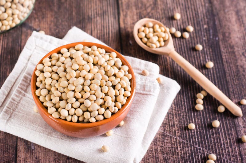 Ripe Soybeans in a Bowl and Spoon on the Table. Vegetable Protein and