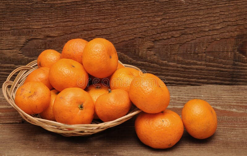 Ripe tangerine fruits in basket