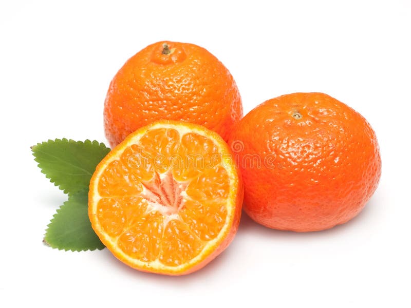 Ripe tangerines with leaves and slices