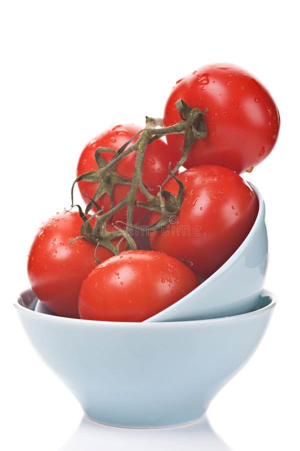 Ripe tomatoes with water drops