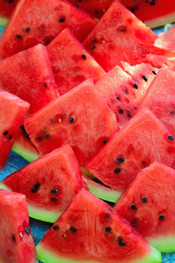 Ripe juicy watermelon, cut into triangle pieces, close-up. Triangular cut watermelon stock images, royalty-free photos and pictures