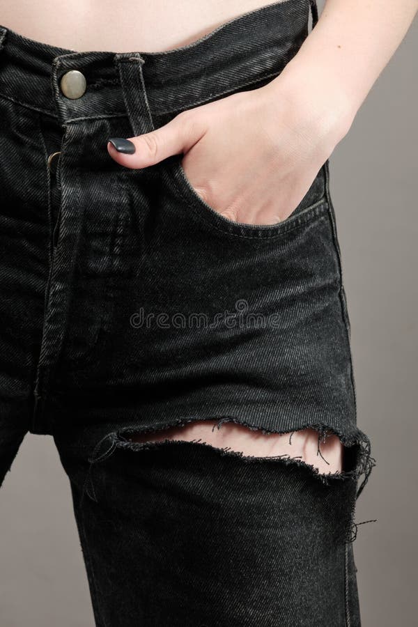 Ripped black jeans stock photo. Image of damaged, modern - 222511300