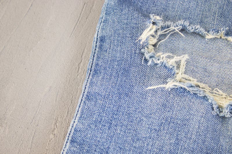 Ripped Destroyed in Wash Blue Denim Jeans. Isolated Background Stock ...