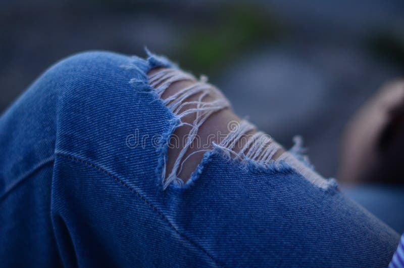 Ripped jeans stock image. Image of embankment, ragged - 96844061