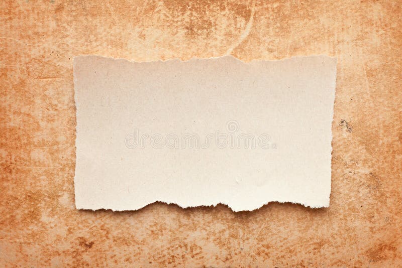 Ripped piece of paper on grunge paper background