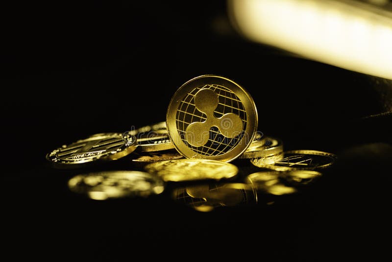 Ripple coin on black background. Currency appreciation. royalty free stock photo