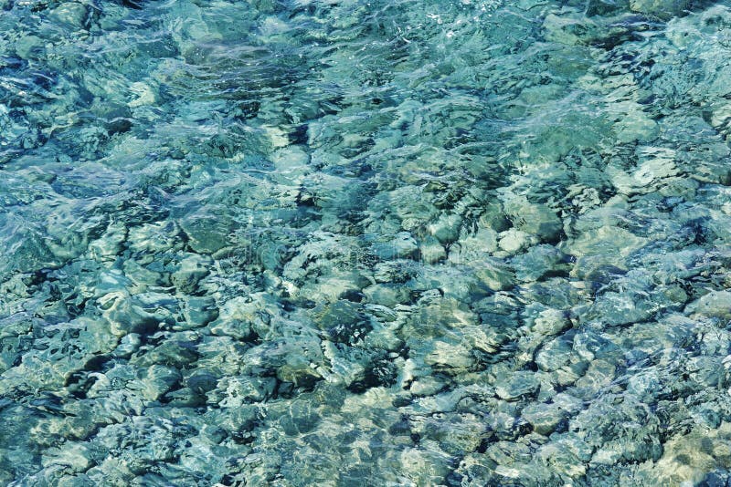 Rippled sea, rocky bottom royalty free stock photos