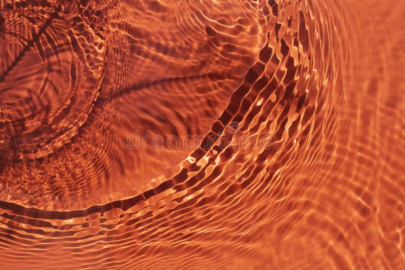 Rippled Water Light Orange Backdrop. Background with Sun Reflection for