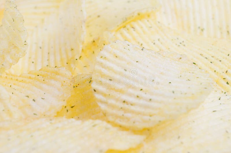 Rippled Yellow Potato Chips Macro with Blur, Background. Stock Photo