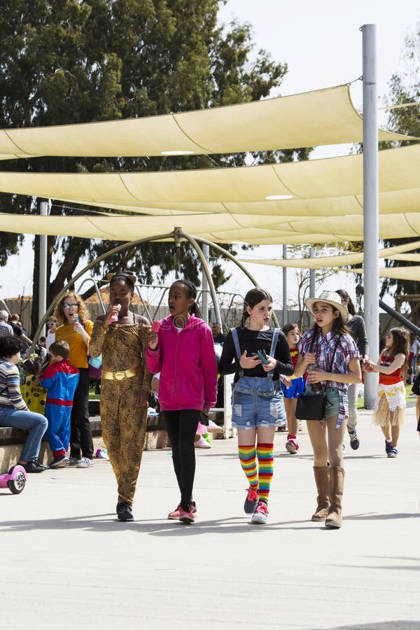 RISHON LE ZION, ISRAEL- MARCH 1, 2018: People wearing costumes in Israel during Purim celebration in Rishon Le Zion, Israel.