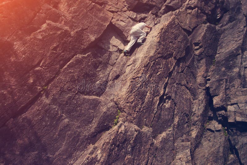 Risky Man Climbing Over Danger Mountain without Safety Harness Stock Image Image of male