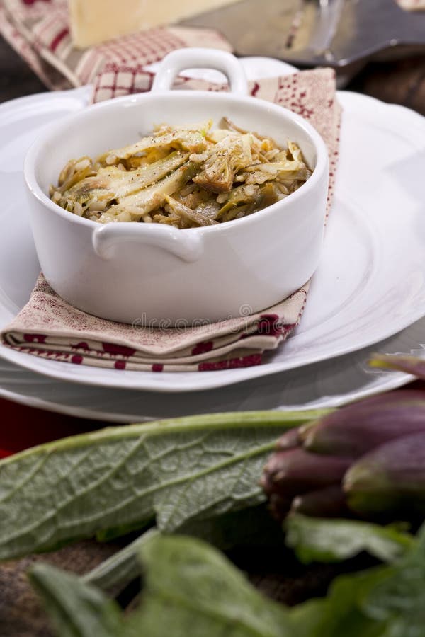 The first dish of rice with artichokes. The first dish of rice with artichokes