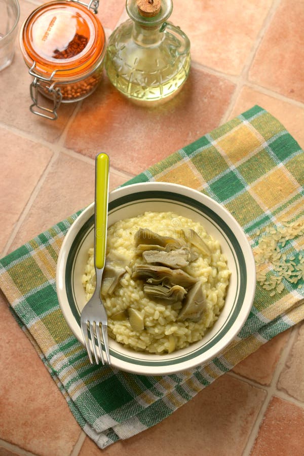 risotto with artichokes in the bowl - closeup