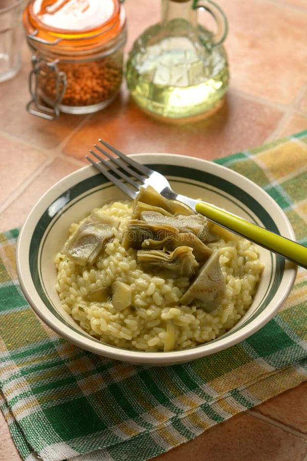 Risotto with artichokes in the bowl - closeup