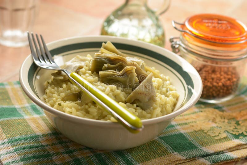 Risotto with artichokes in the bowl - closeup