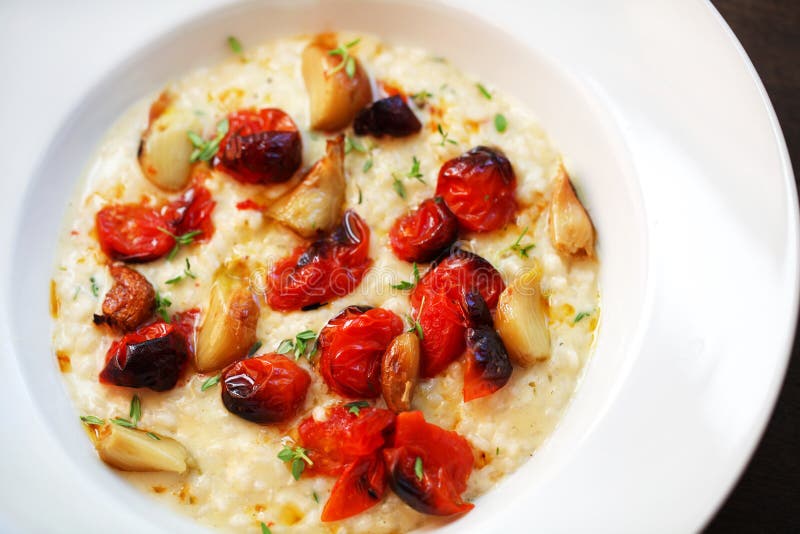 Risotto with Oven Roasted Cherry Tomatoes and Mozzarella Stock Photo