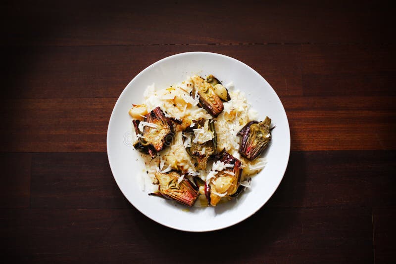 Risotto with buffalo mozzarella, roasted baby artichokes and parmesan. Risotto with buffalo mozzarella, roasted baby artichokes and parmesan