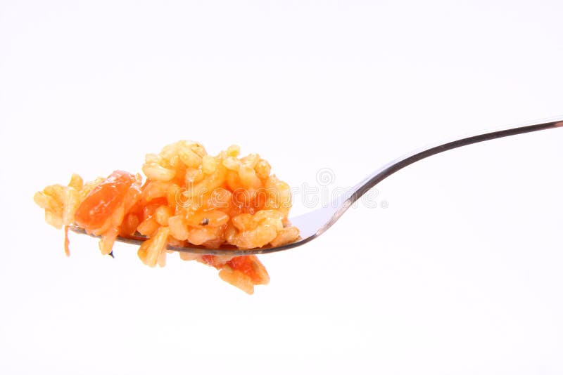 Risotto with tomatoes on a fork