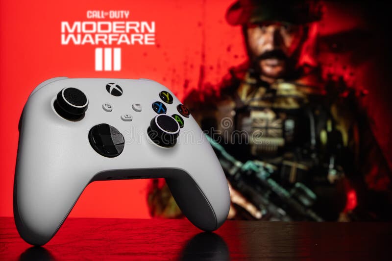 Rita styrenheter för robot i xbox med tjänstens hjälp, modern krigföring iii spel oskarpt i bakgrunden fotografering för bildbyråer