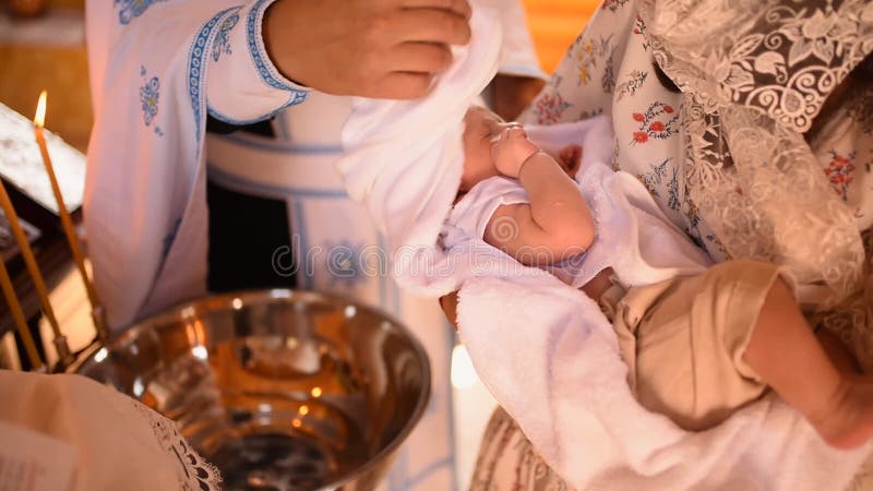 Rite of sacrament of epiphany child baby in church