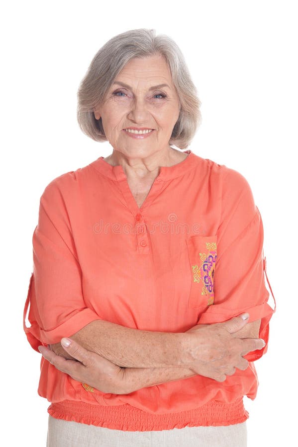 Ritratto della donna senior sorridente che porta blusa arancio immagini stock libere da diritti Ritratto della donna senior sorridente che porta blusa arancio immagini stock libere da diritti
