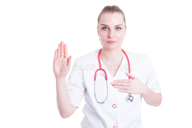 Ritratto di medico serio della donna che fa un giuramento immagini stock Ritratto di medico serio della donna che fa un giuramento immagini stock