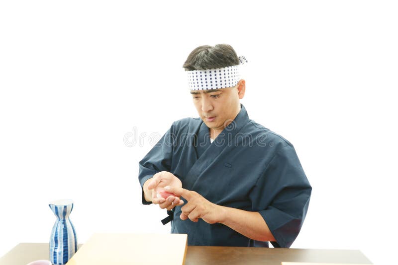 Ritratto di un cuoco unico di sushi fotografie stock
