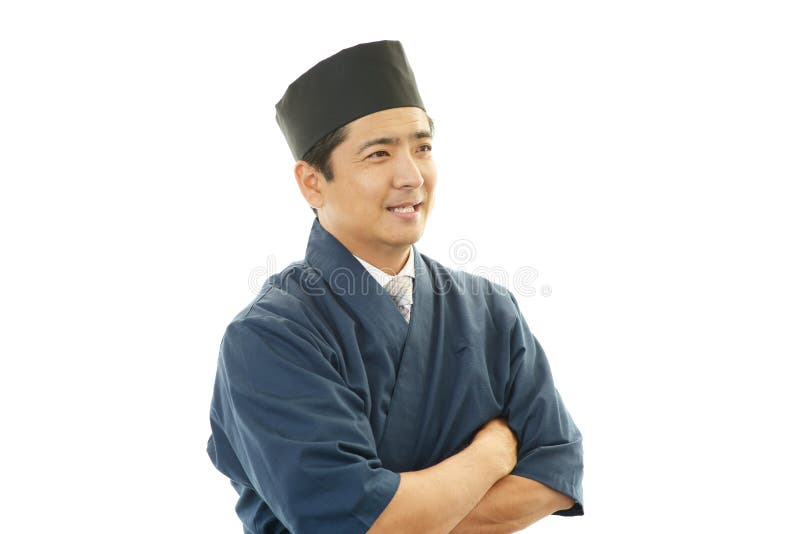 Ritratto di un cuoco unico di sushi in uniforme