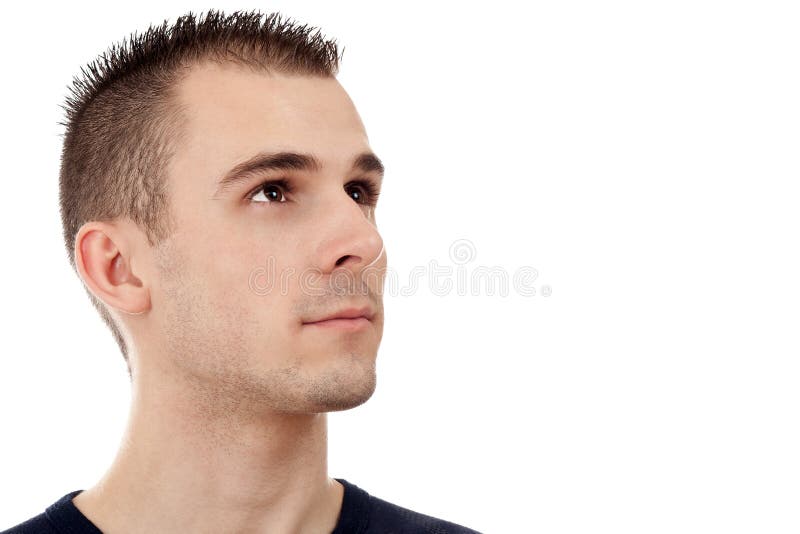 Ritratto di un giovane bello che osserva verso l'alto immagine stock Ritratto di un giovane bello che osserva verso l'alto immagine stock