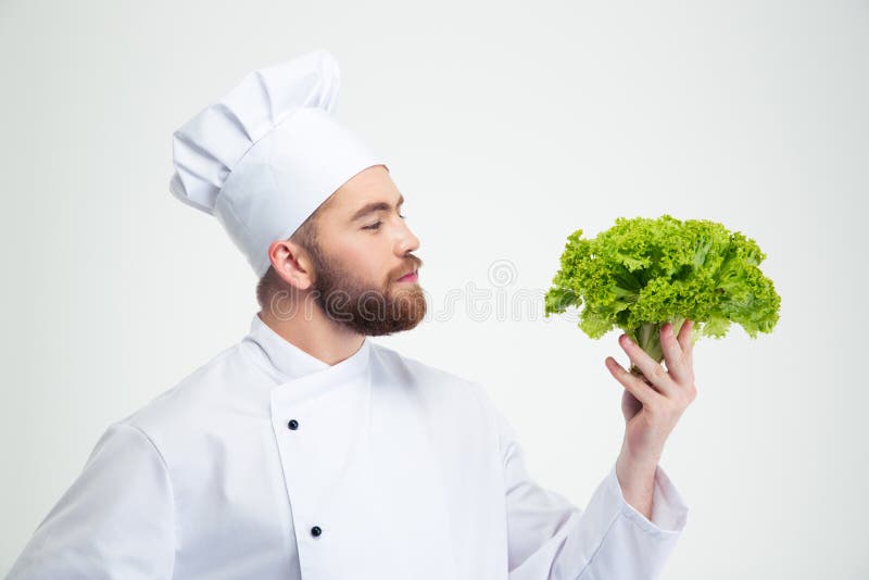 Ritratto di un'insalata maschio bella della tenuta del cuoco del cuoco unico immagine stock libera da diritti Ritratto di un'insalata maschio bella della tenuta del cuoco del cuoco unico immagine stock libera da diritti