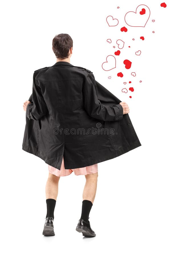 Ritratto integrale di un lampeggiatore in un cappotto e cuori intorno alla h immagine stock libera da diritti Ritratto integrale di un lampeggiatore in un cappotto e cuori intorno alla h immagine stock libera da diritti