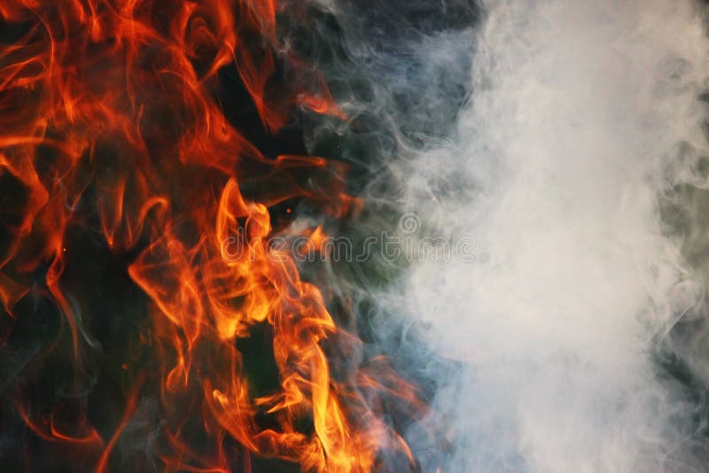 A Ritual Dance Of Fire And Smoke Against A Background Of Green Grass