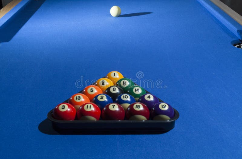 All billiard balls focused on pool. All billiard balls focused on pool