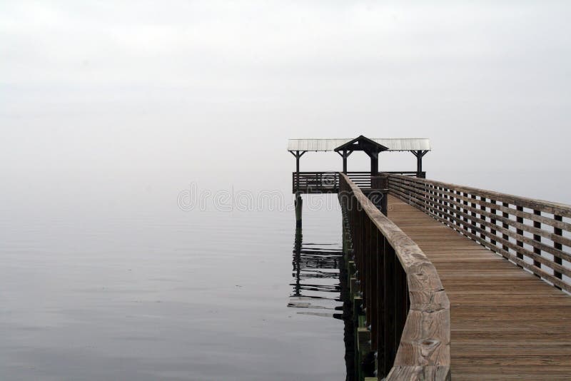 River dock on a foggy afternoon