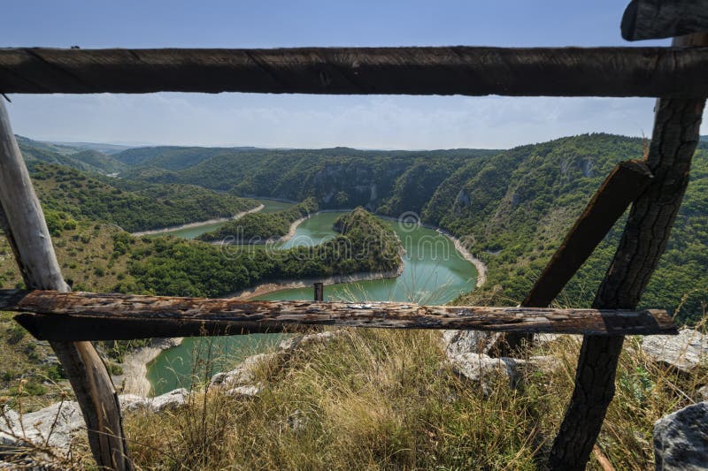 River meanders between defocused wood bars 2