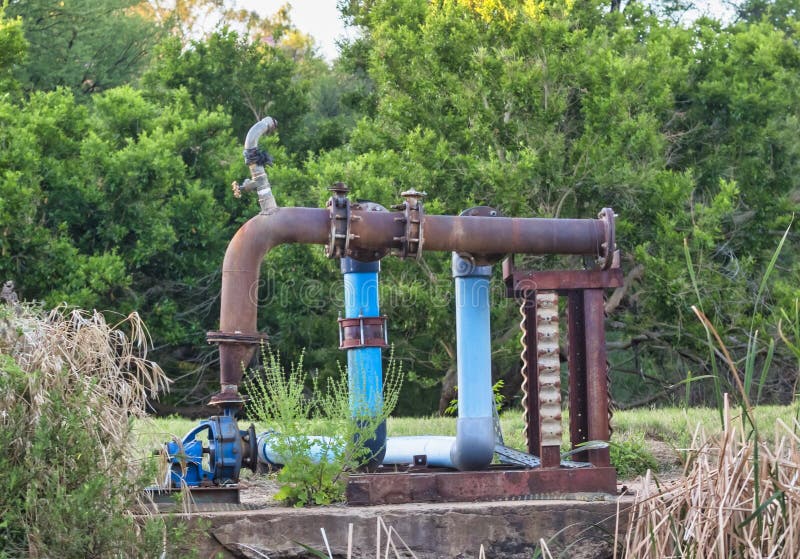 Water pump at the river stock photo. Image of outside 233173330