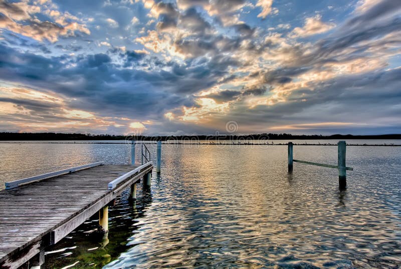 River Pier at Sunset, with Dramatic Cloudscape Stock Image Image of