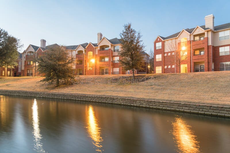 Riverside Apartment Building Complex Reflection at Blue Hour Stock