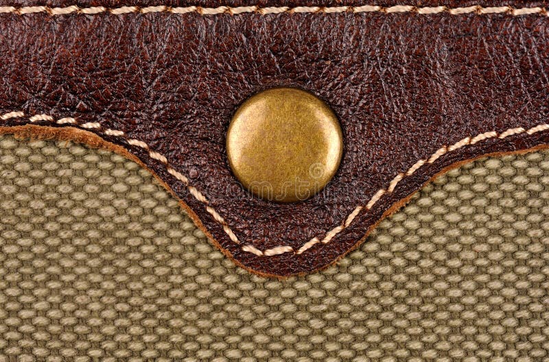 Rivet button on the leather and fabric. macro photo. Button clasp stock images, royalty-free photos and pictures