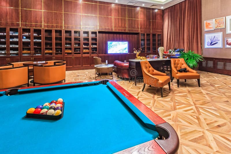Rixos Hotel cigar lounge interior with modern furniture, comfortable setting and a billiard table turns waiting into a pleasant pa