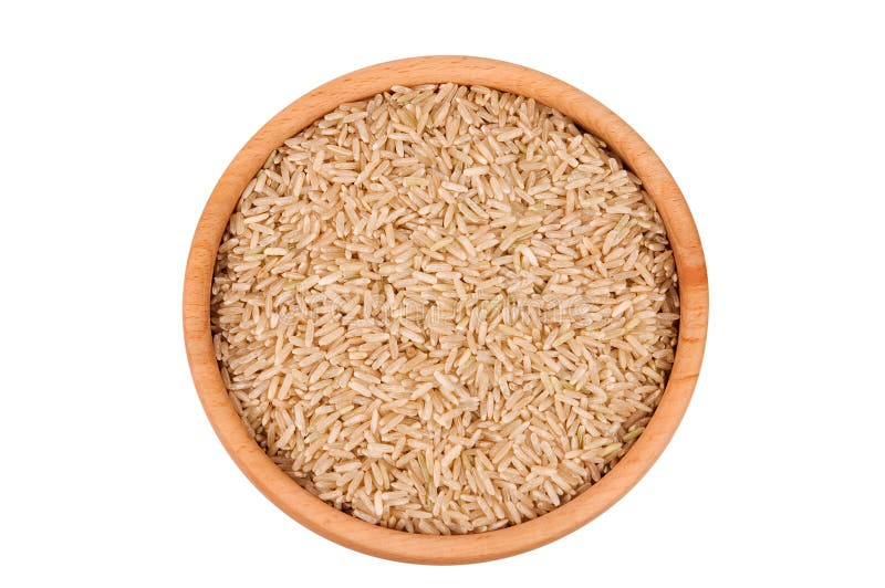 Raw brown rice in wooden bowl isolated on white. Raw brown rice in wooden bowl isolated on white